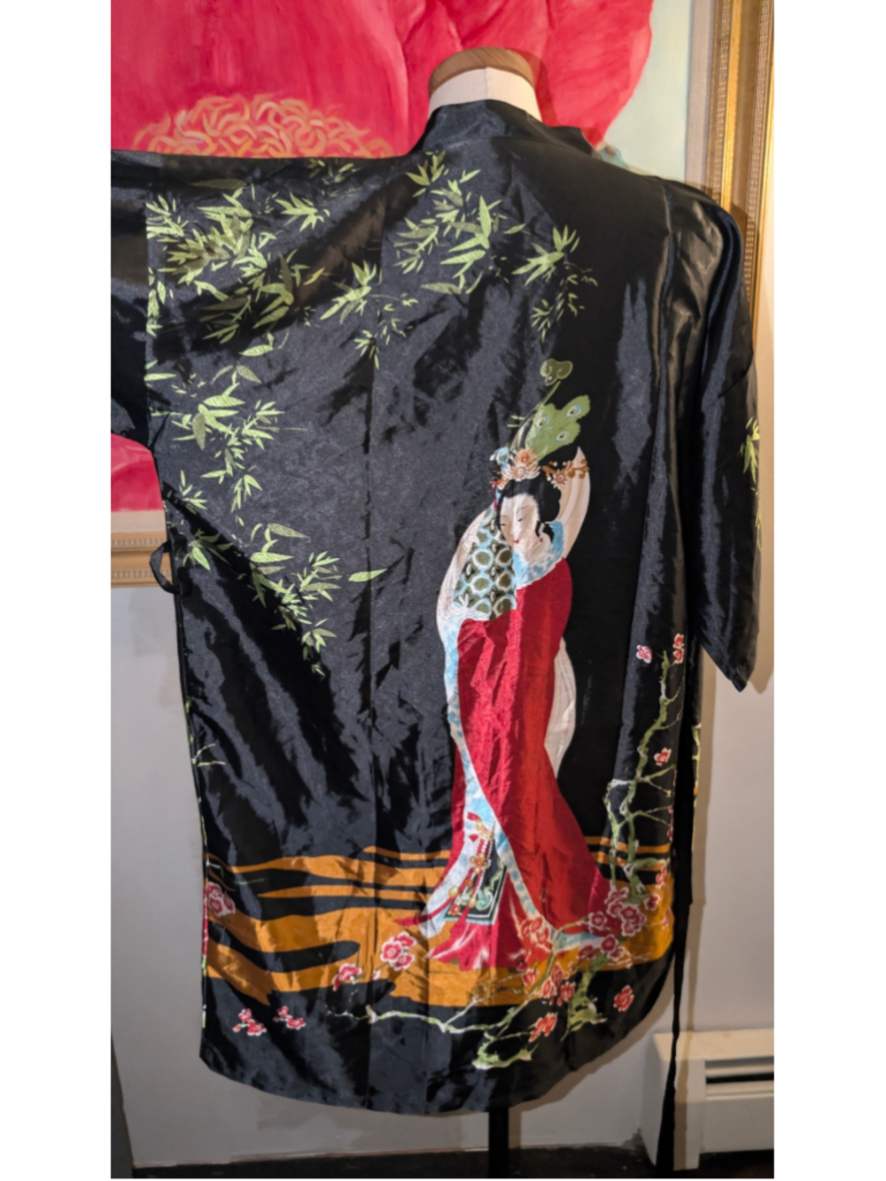 This is a vintage silk kimono robe featuring intricate Asian-inspired designs